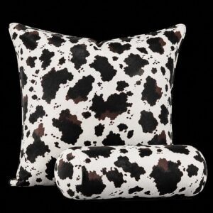 Custom leather cow-print throw pillow and matching bolster