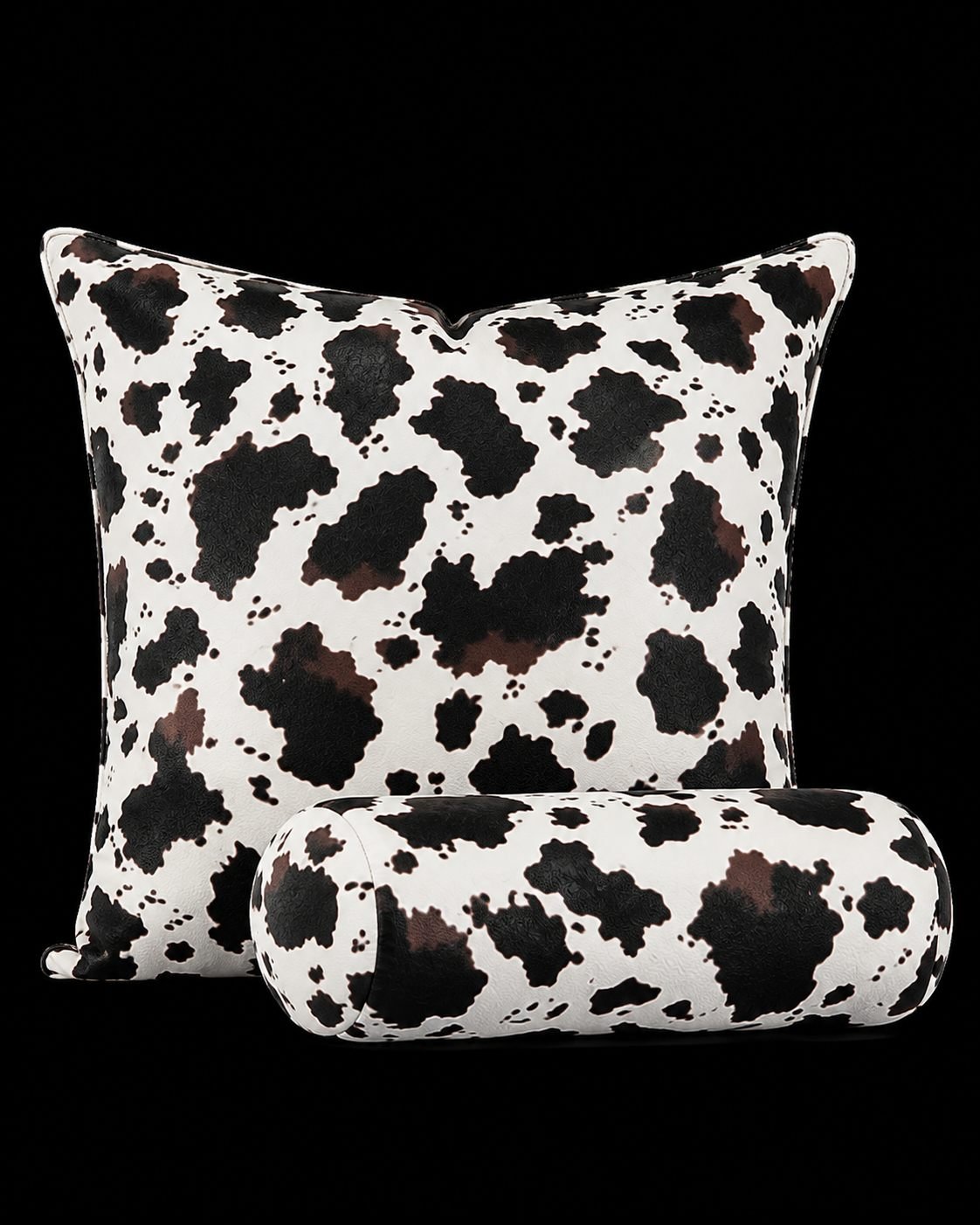 Custom leather cow-print throw pillow and matching bolster