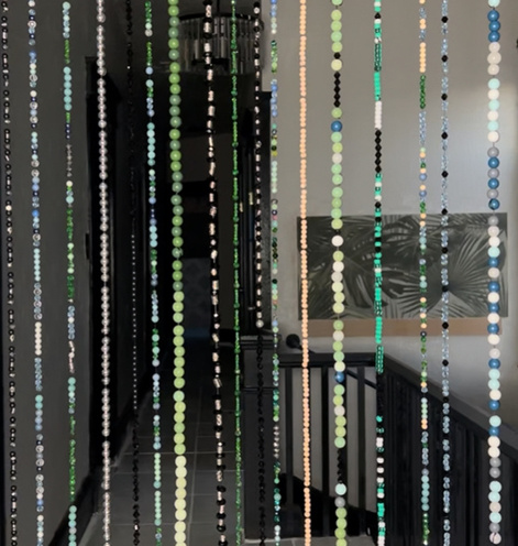 Beaded curtain in home office doorway